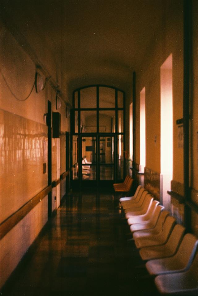 Empty hospital hallway and waiting chairs