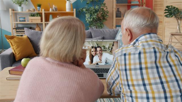 Senior couple on a video call with family at home