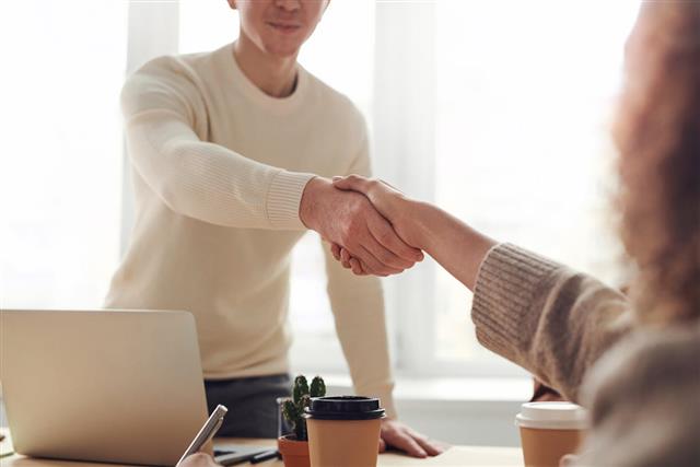 Handshake confirming straightforward final expense approval