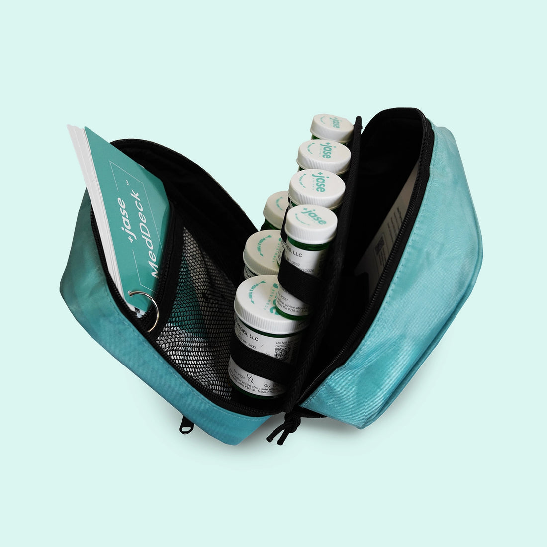 Open emergency medical kit case with organized medications